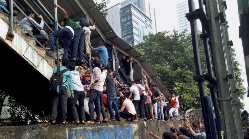 At least 22 people were killed in a stampede on foot overbridge at Elphinstone Road Railway station on Friday. (Photo: PTI)