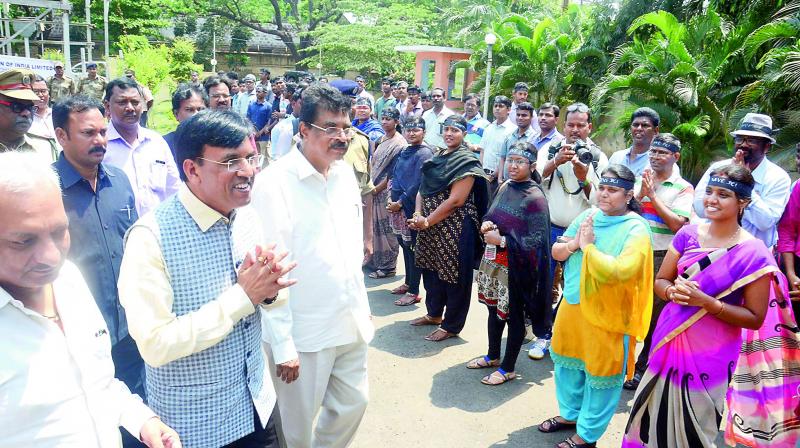 Union Minister for Shipping Mansukh Mandaviya speaks to employees of DCIL during his visit to the office in Visakhapatnam on Saturday. Employees of DCI were on protest against the governments move to privatise the company. Vizag MP K. Haribabu and the CMD of DCIL Rajesh Tripathi are also seen. (Photo: DC)