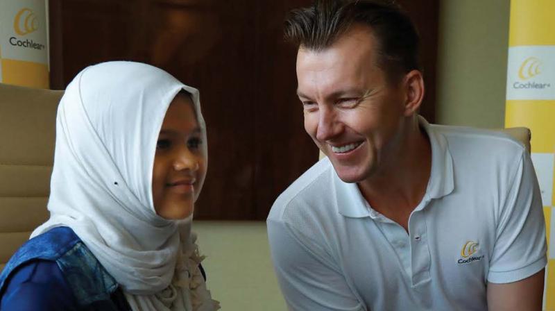 Australian pacer Brett Lee with 11-year-old Fida Fathima, a recipient of Cochlear implant, at a press conference in Kochi on Thursday. (Photo: ARUN CHANDRABOSE)
