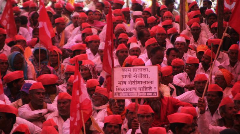 Thousands of farmers, carrying red flags, earlier converged at Mumbais Azad Maidan after walking around 180 kilometres under blazing sun over the last six days. (Photo: Mrugesh Bandiwadekar)