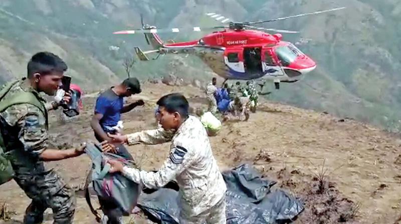 Bodies recovered by the Garud commandos of the IAF were found lying in crevices on steep rocky slopes  at the Kurangani forest in Theni on Monday. (Photo: DC)