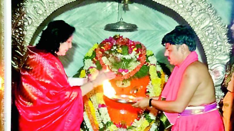 Dr J. Geetha Reddy prays at the Siddivinayaka temple at Rejinthal in Zaheerabad constituency on Saturday.