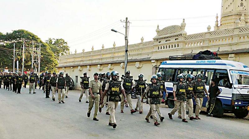 Police  personnel being deployed on the eve of Tipu Jayanti, in Srirangapatna on Friday.  (KPN)