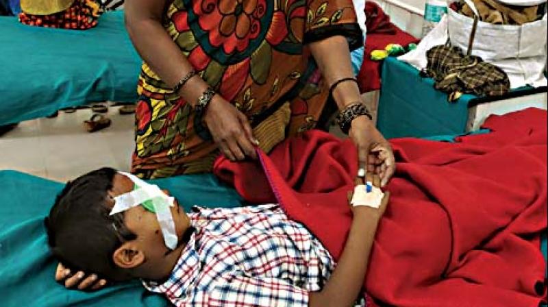 Maunesh, who was injured while bursting crackers,  under treatment at a hospital in Bengaluru on Friday. (DC)