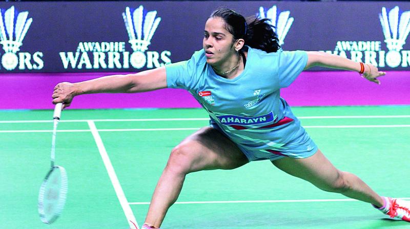 Awadhe Warriors Saina Nehwal en route to her 8-15, 15-10, 15-13 win over Beiwen Zhang of Mumbai Rockets in their PBL match in Lucknow on Thursday.