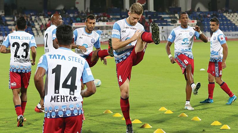 Jamshedpur FC players at a practice session on their home ground on Thursday.