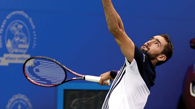 Croatias Marin Cilic in action against Pierre-Hugues Herbert of France in their Tata Open quarter-final in Pune on Thursday. Cilic won 6-3, 6-2.