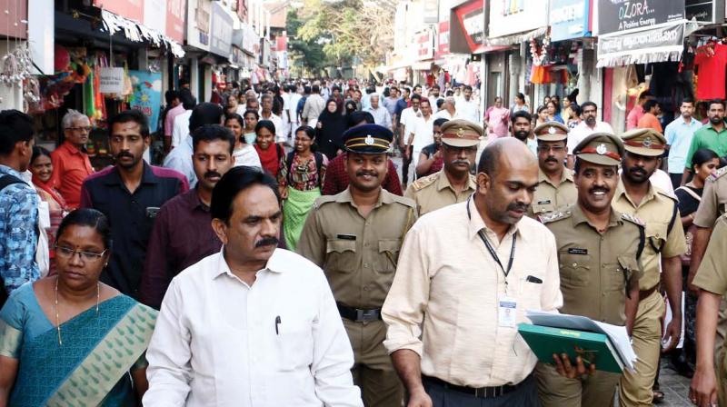 A team led by collector U. V. Jose visits SM Street in Kozhikode on Thursday (Photo: DC)