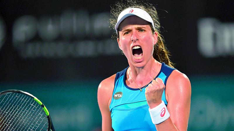 Johanna Konta of Britain celebrates a point against Canadas Eugenie Bouchard during their womens semifinal in Sydney on Thursday.  AFP