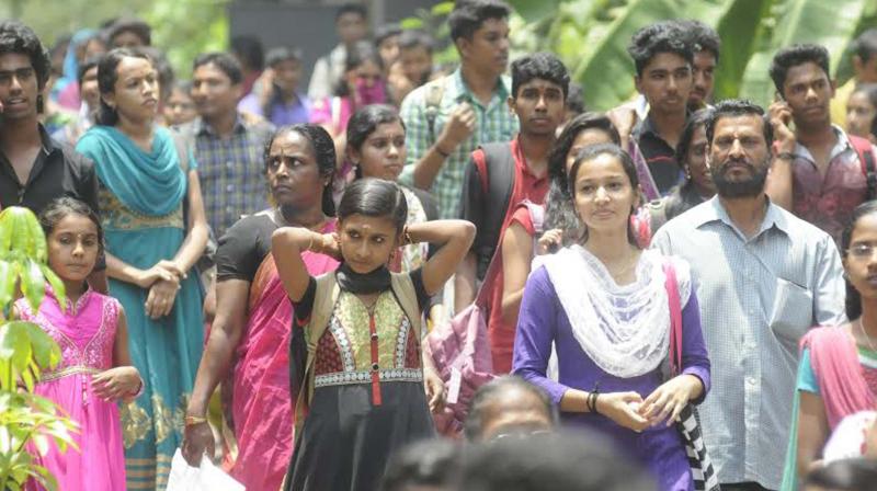 Students coming out at  Government College for Women, Thiruvananthapuram after writing the Kerala engineering entrance examinations.(Photo: A.V. Muzafar)