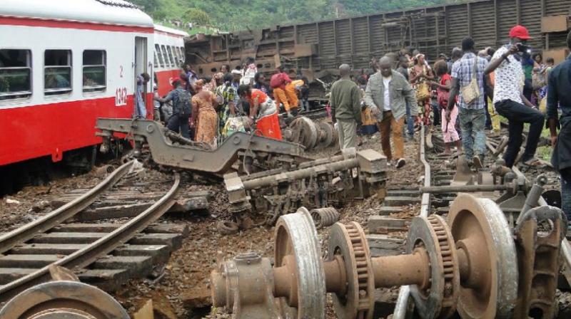 Passenger escape the site of a train derailment in Eseka on Friday. (Photo: AFP)