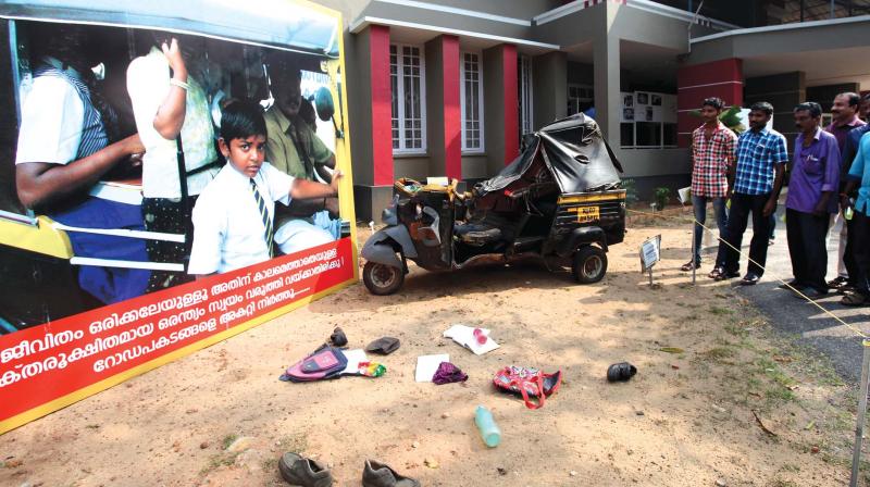 Visitors at an installation of an accident involving an autorikshaw carrying school children at the traffic awareness show being held at kollam Police club. The installation was set up by H. Shanavas, assistant sub-inspector with the city traffic police.