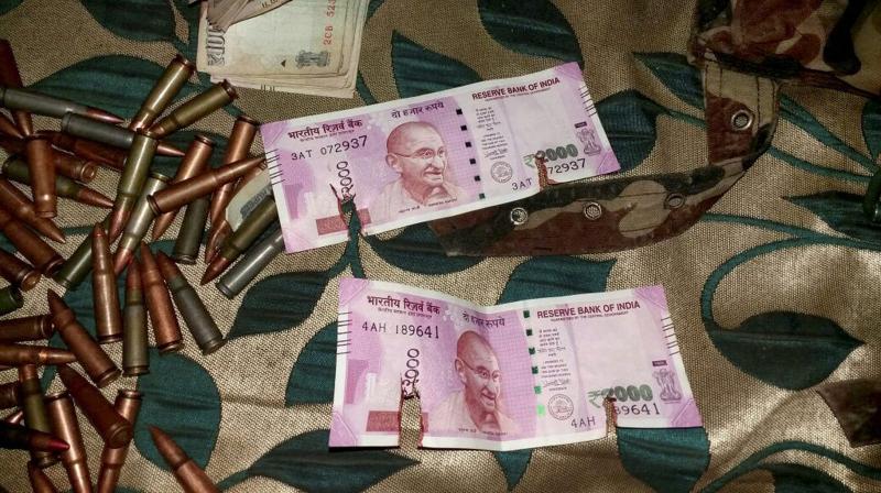New currency notes of Rs 2000 denomination recovered from militants killed in Bandipora District of North Kashmir. (Photo: PTI)