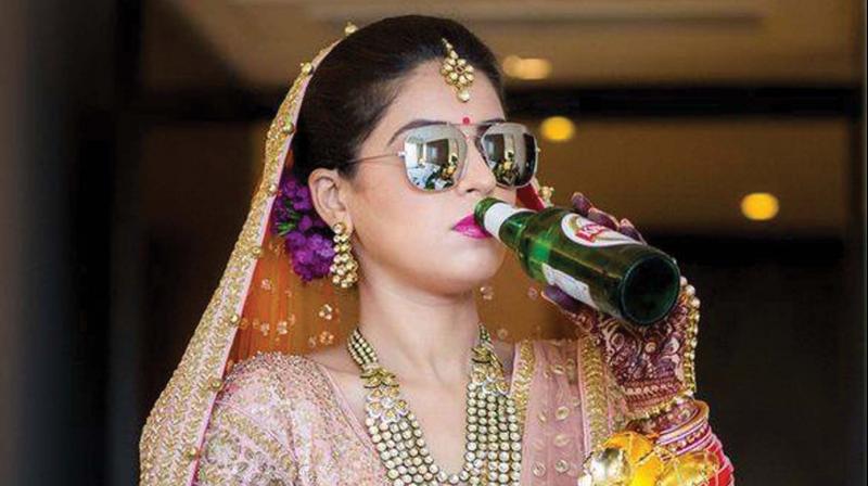 A bride glugs beer in this photograph used for representative purposes only.