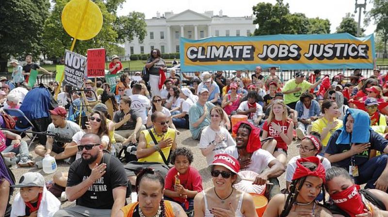 Participants in the Peoples Climate March say theyre objecting to Trumps rollback of restrictions on mining, oil drilling and greenhouse gas emissions at coal-fired power plants, among other things. (Photo: AP)