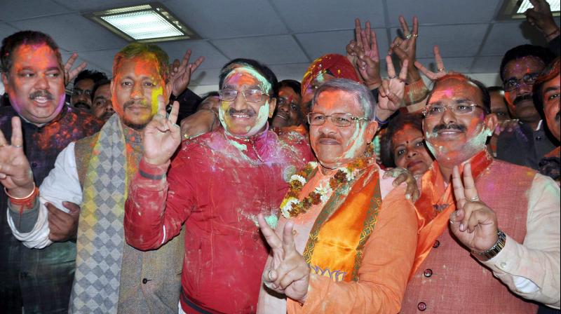 BJP in-charge for Uttarakhand, Shyam Jaju with Ramesh Pokhriyal Nishank celebrating the partys victory in Assembly elections in Dehradun. (Photo: PTI/File)