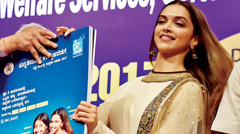 Actress Deepika Padukone releases an awareness poster during World Heath Day at NIMHANS Convention Centre in Bengaluru on Saturday (Photo: KPN)