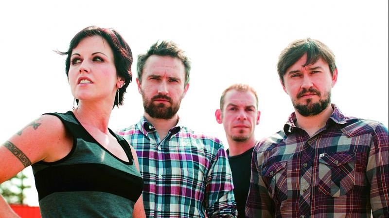 Dolores with members of the music band Cranberries