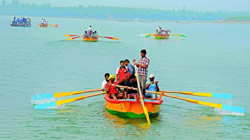 Youngsters take part in boat race competition at Nagayalanka Pushkar ghat in Krishna district.