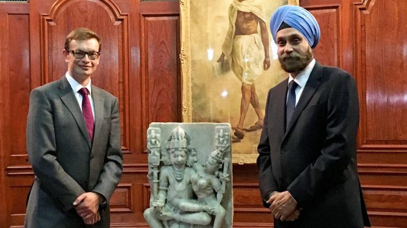 Indian high commissioner to the UK, Navtej Sarna, takes possession of a stolen 12th century Brahma sculpture at India House in London. (Photo: PTI)
