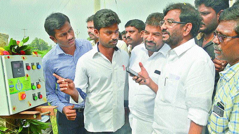 Agri Minister Somireddy Chandramohan Reddy switching on a power saving motor on Monday. (Photo: DC)