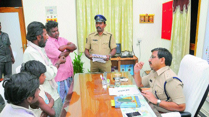 Nellore SP P.H.D. Ramakrishna listens to peoples grievances at district police office in Nellore on Monday. (Photo: DC)