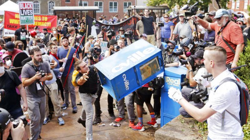 A woman was killed and 19 were injured when a car ploughed into a crowd of counter-protesters in Charlottesville. (Photo: AP)