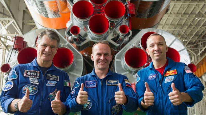 Astronaut Randy Bresnik (R), astronaut Paolo Nespoli (L) and Russian cosmonaut commander Sergei Ryazansky (C) are due to blast off into space on Friday. (Photo: AFP)