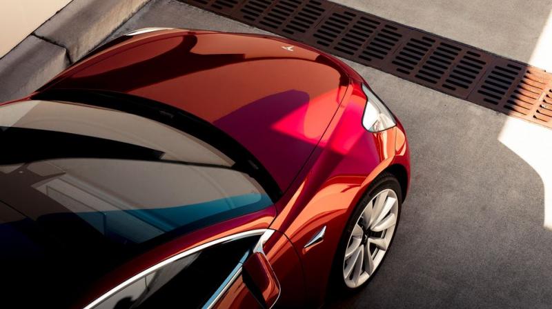 Musk took to the stage driving a red Model 3, and said Tesla has produced 50 of the vehicles so far, including 20 for testing purposes. (Photo: Tesla)