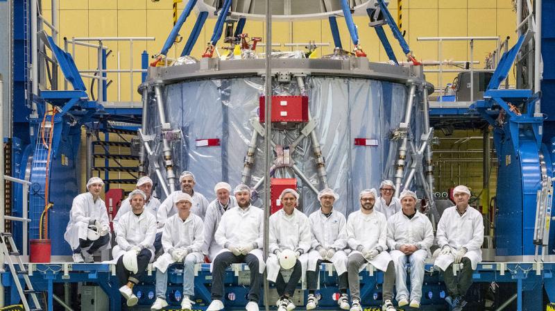 The Airbus team poses with the European Service Module during preparations for shipment to NASAs Kennedy Space Center. (Image Credit: NASA/Rad Sinyak)