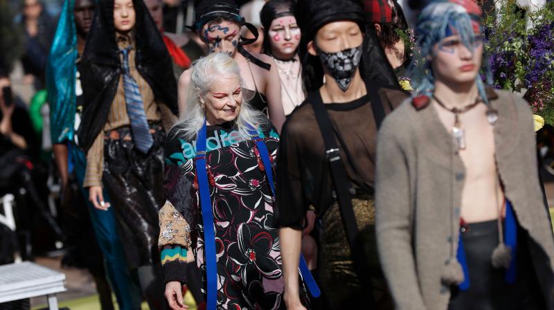 British fashion designer Vivienne Westwood (R) acknowledges the audience at the end of Austrian fashion designer Andreas Kronthalers 2018/2019 fall/winter collection fashion show on March 3, 2018 in Paris. (Photo: AFP)