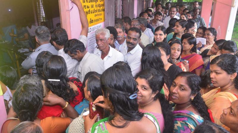 Huge crowd at a polling booth in Chengannur on Monday.