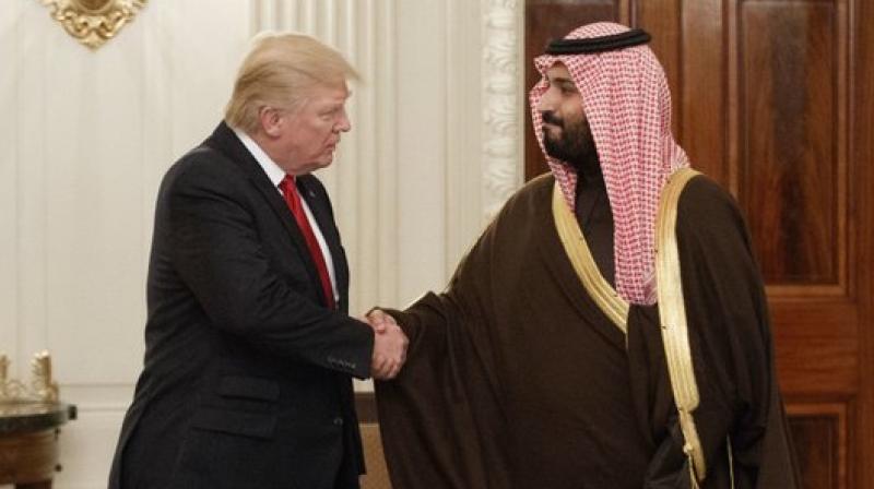 President Donald Trump shakes hands with Saudi Defense Minister and Deputy Crown Prince Mohammed bin Salman, in the State Dining Room of the White House in Washington.  (Photo: AP)