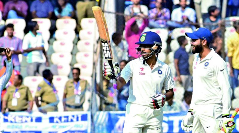 Wriddhiman Saha acknowledges cheers after scoring a century on the second day of the Test against Bangladesh on Friday. (Phtoo: DC)