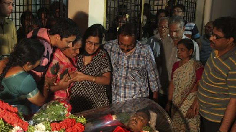 Relatives grieve around the body of Srinivas Kuchibhotla after the body was flown from the US to his residence on the outskirts of Hyderabad. (Photo: AP)