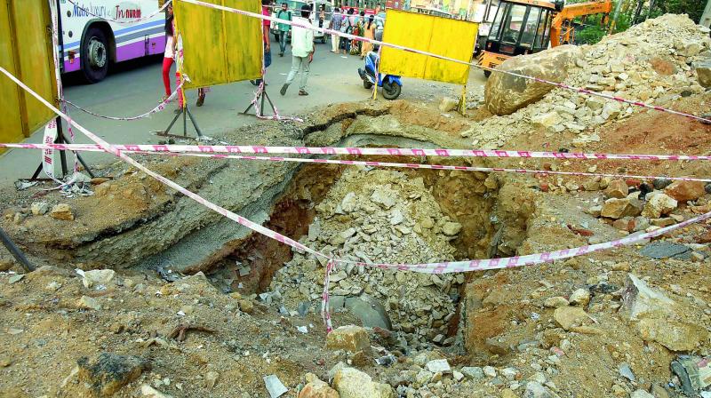 op: The pit dug by the Water Board near JNTU, where work is going on slowly. Bottom: The water line that is being laid below the drain pipeline.(Photo:DC)