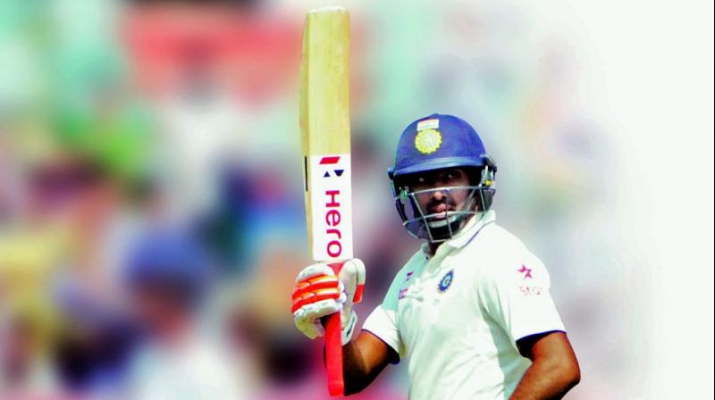 R. Ashwin raises his bat to acknowledge the crowd after he scored a half century during the second day of the second Test against England. (Photo  Murali Krishna)