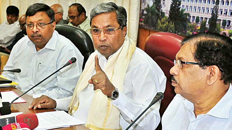 Chief Minister Siddaramaiah and Home Minister Dr G. Parameshwar at a press conference in Bengaluru on Friday