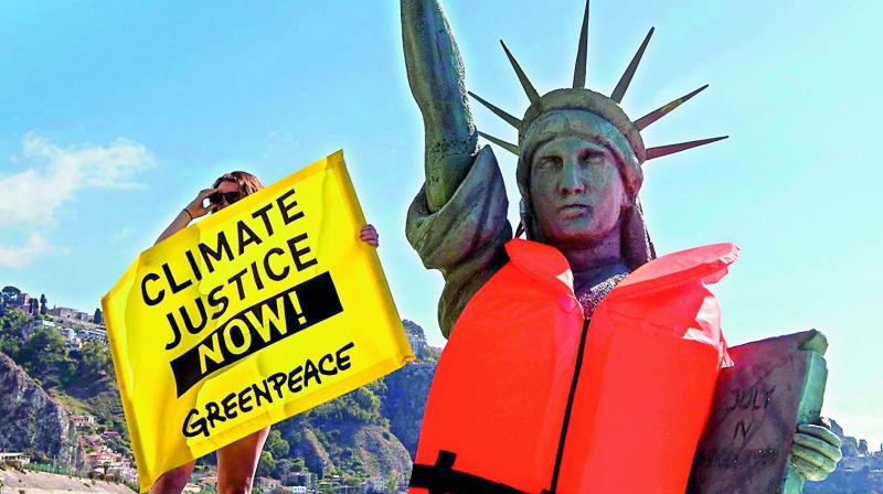 Greenpeace activists stage a demonstration near the venue of the G7 summit in Taormina. (Photo: AP)