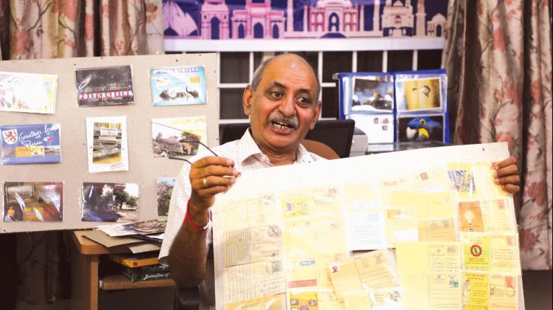 Colonel Anil Kumar (retd) with his postcards (Photo: R. Samuel)