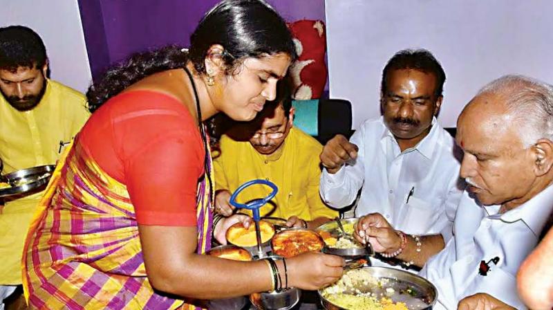 BJP leaders B.S. Yeddyurappa having breakfast at a Dalits house in Hubballi