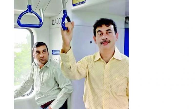 Principal Secretary Jayesh Ranjan travels on Metro on Tuesday. (Image Dc)