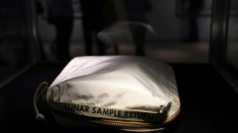 The Apollo 11 Contingency Lunar Sample Return Bag, used by Neil Armstrong on Apollo 11 to bring back the very first pieces of the moon ever collected, is displayed during a media preview for Space Exploration auction in New York. (Photo: AFP)