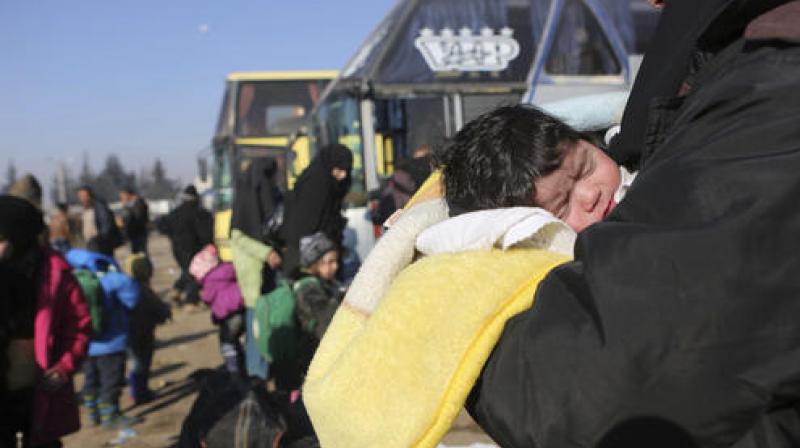 Syrians evacuated from the embattled Syrian city of Aleppo during the ceasefire arrive at a refugee camp in Rashidin, near Idlib, Syria. (Photo: AP)