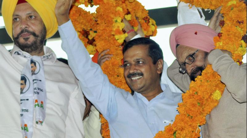 National Convener of Aam Aadmi Party (AAP) and Delhi Chief Minister, Arvind Kejriwal is garlanded during a rally in Samana, Patiala. (Photo: PTI)