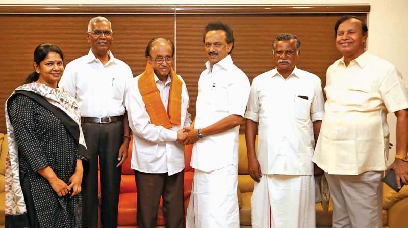 DMK president M.K. Stalin greets CPI leader Sudhakar Reddy at Anna Arivalayam in Chennai on Tuesday.  Also seen are (L to R) DMK MP Kanimozhi, CPI MP D. Raja , State CPI secretary R. Mutharasan and former union minister T.R. Baalu. (Photo: DC)
