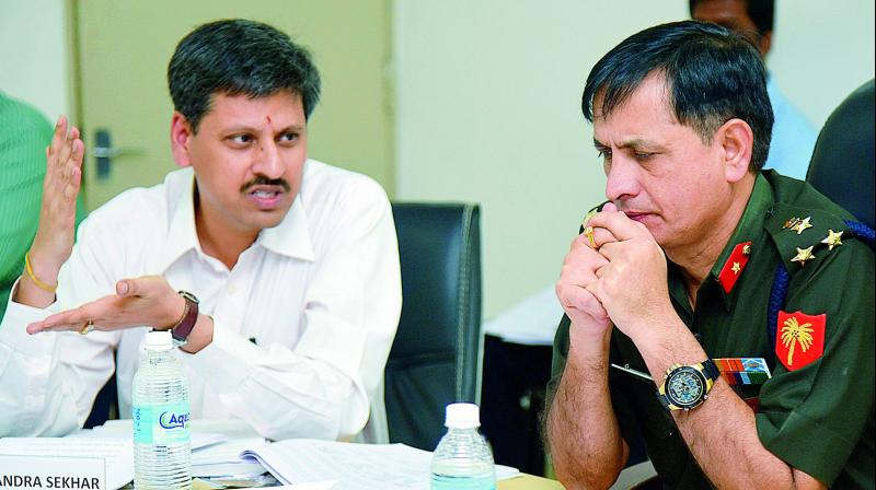 Cantonment Board official S.V.R. Chandrasekhar and Brig. Ajay Malik, SCB president, at the SCB meeting on Tuesday. 	(Photo: DC)