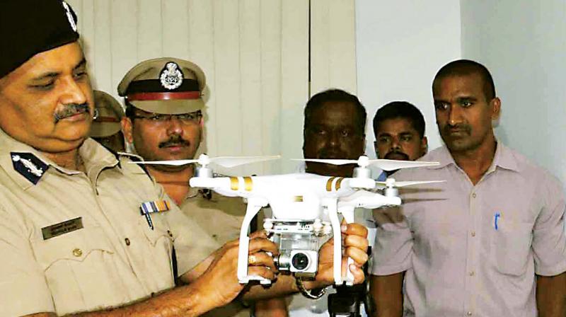 City Police Commissioner Praveen Sood inspects stolen goods during a press conference in Bengaluru on Tuesday -KPN