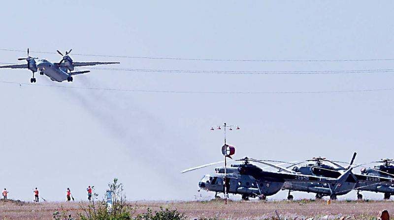 An IAF aircraft flies past Yelahanka Airbase on Monday. (Photo: Shashidhar B.)