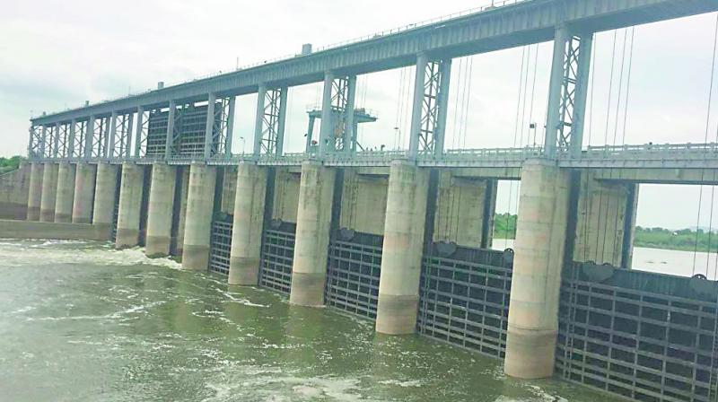 Water is released into river Godavari from Babli project near the Telangana-Maharashtra border on Saturday. 	(Photo: DC )